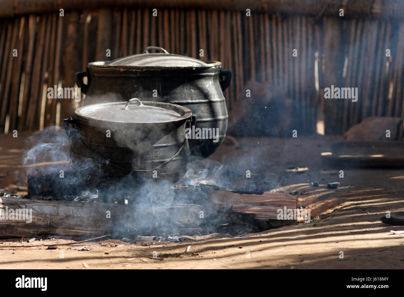 smoke smoking smokes fume africa boil cooks boiling cooking fire
