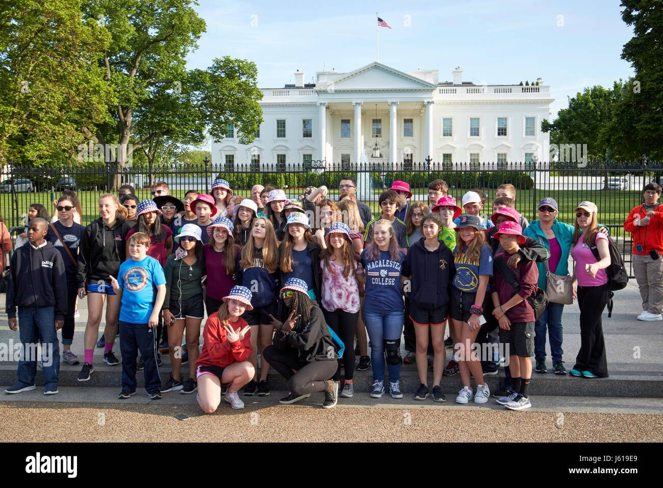 tourist school group outside the north facade from pennsylvania avenue the white house Washington DC USA Stock Photo