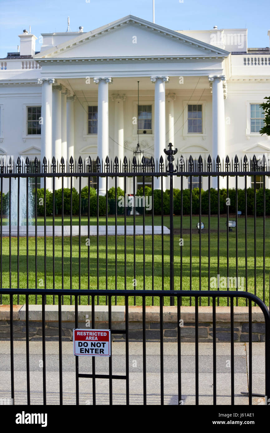 security fence and restricted area signs outside the north facade from pennsylvania avenue the white house Washington DC USA Stock Photo