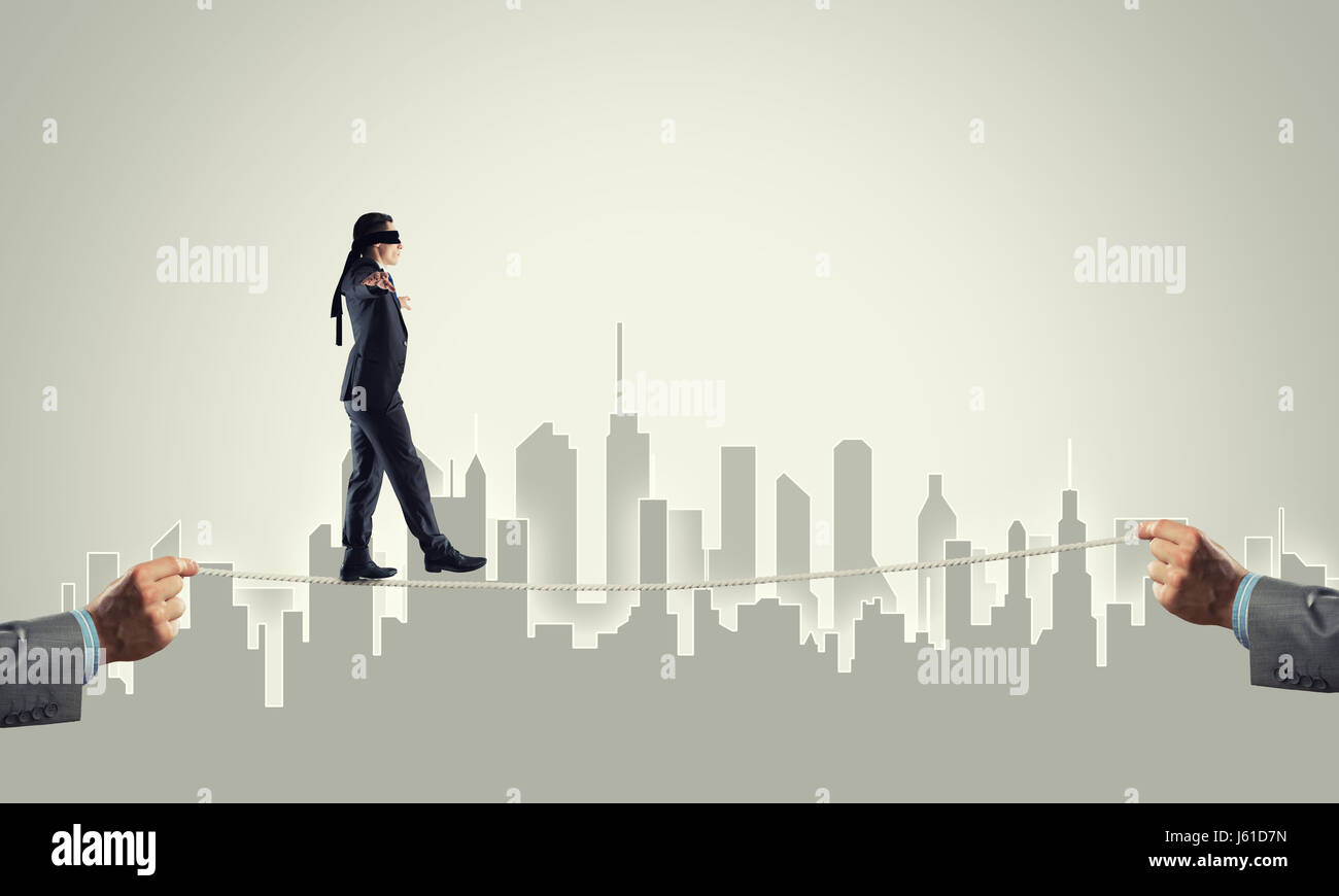 Business concept of risk support and assistance with man balancing on ...