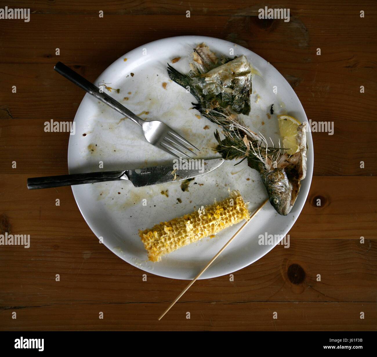 mangy,fish,plate,trout,fish bones,cutlery,eaten up,food,essensreste Stock Photo Alamy