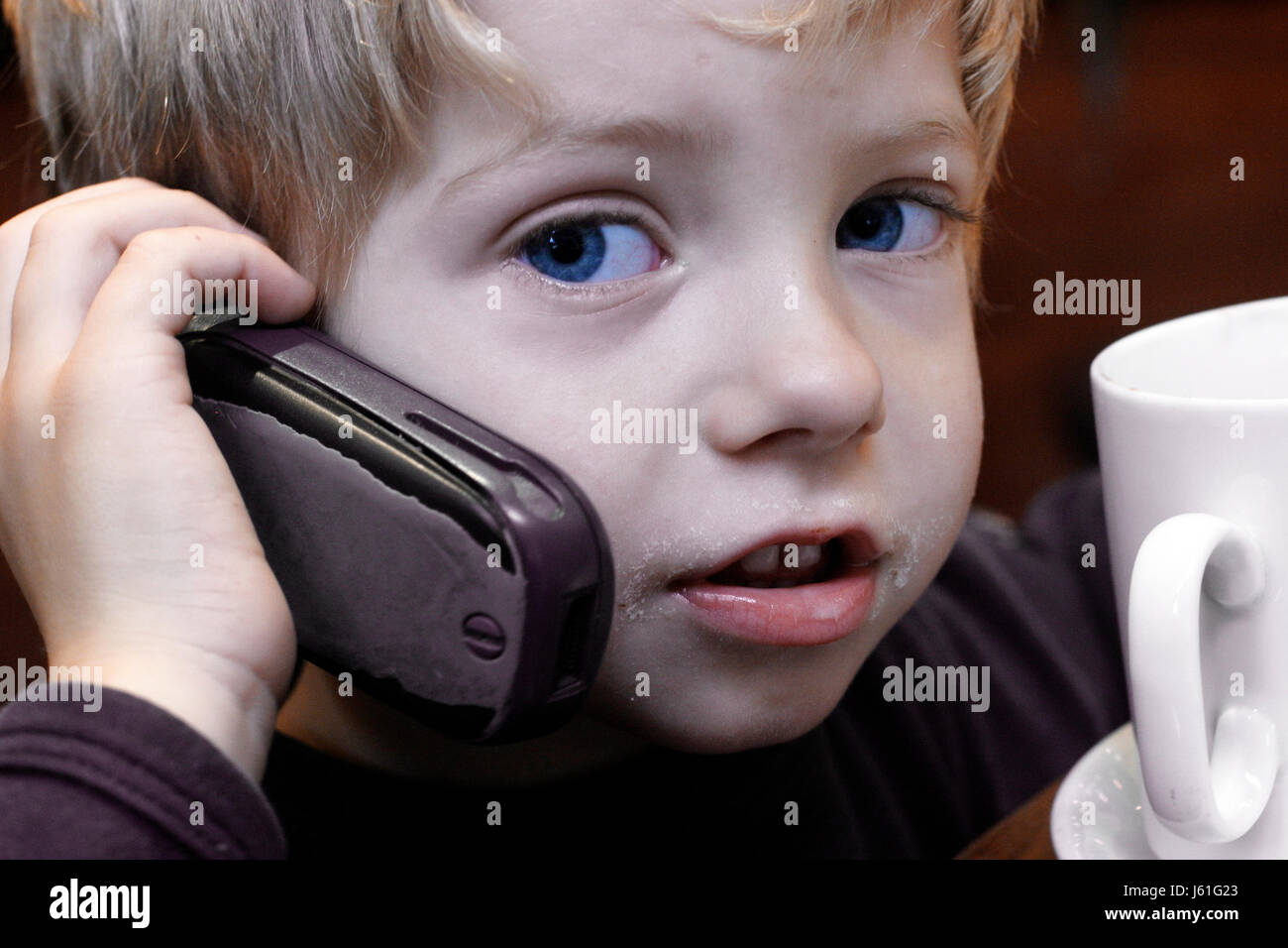 boy with cell phone Stock Photo - Alamy