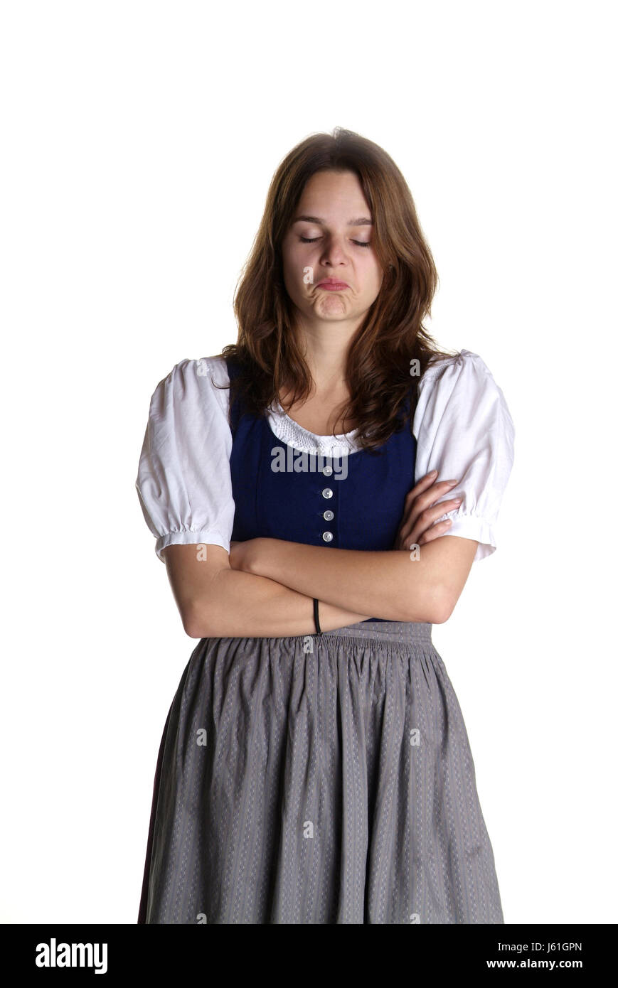 woman sulk defiant slipping dirndl arm young younger offended scathes isolated Stock Photo