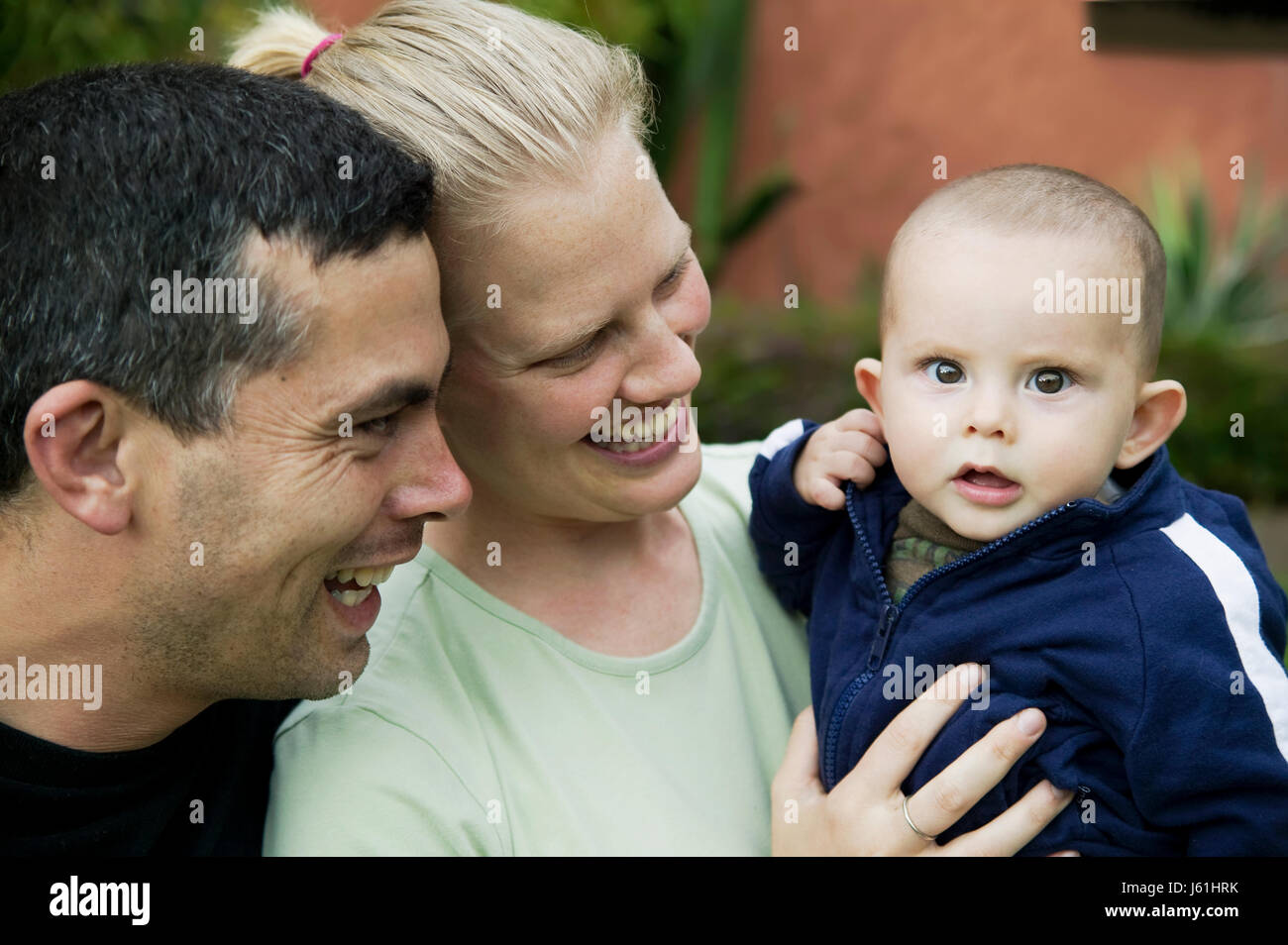 baby blonde mother mom ma mommy latin familiy family hispanic father daddy  dad Stock Photo - Alamy, image size:1300x954