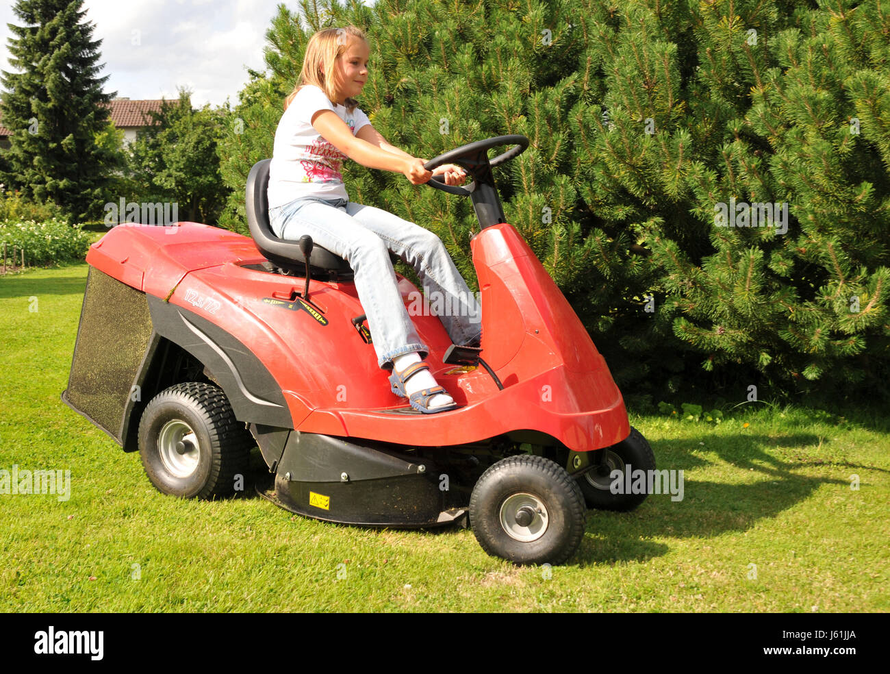 agriculture farming gardening lawnmower child girl girls teens teenagers youth Stock Photo