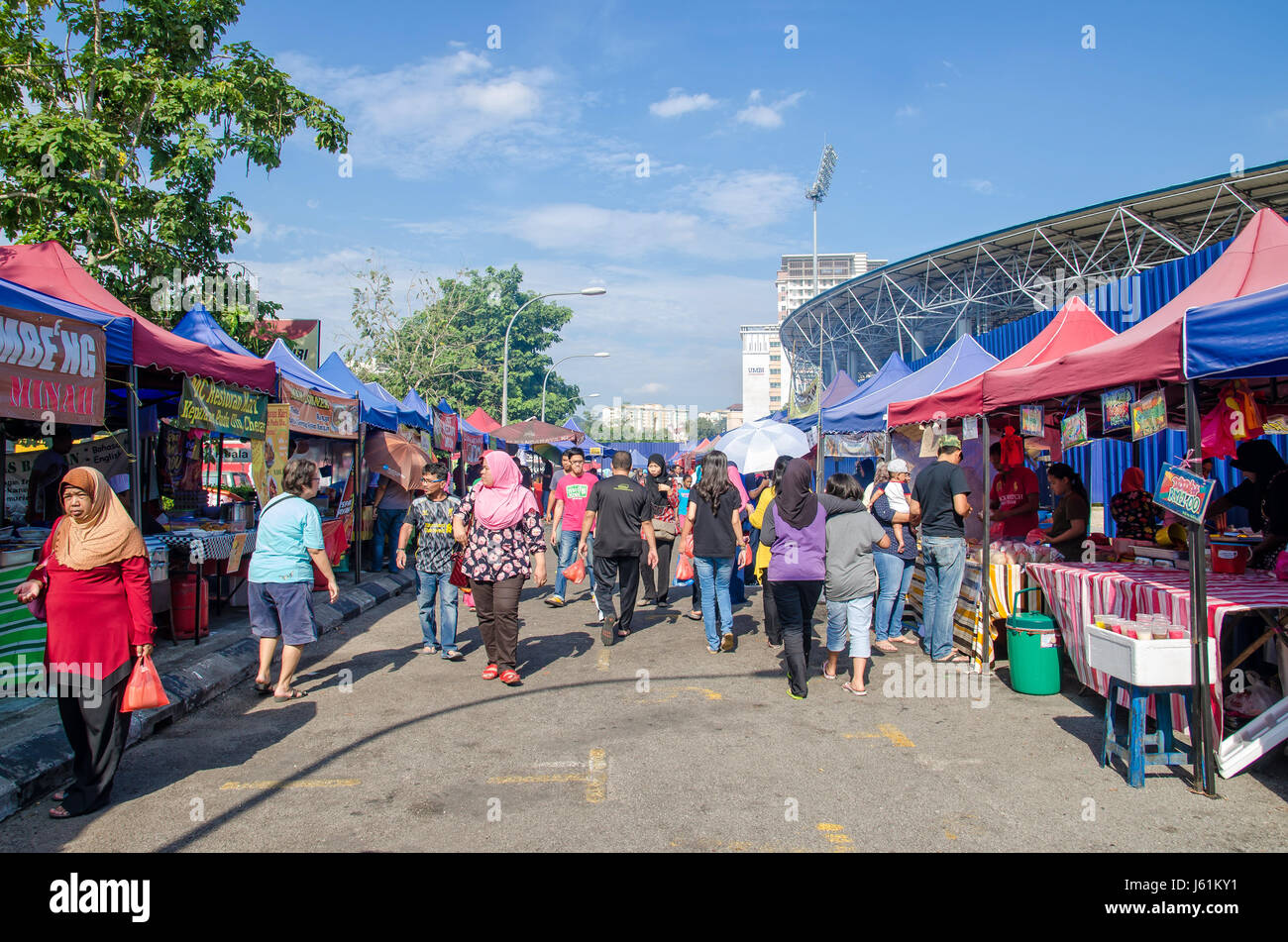 Kuala Lumpur,Malaysia - July 5, 2015: People seen walking and buying foods around the Ramadan Bazaar during the holy month of Ramadan. Stock Photo