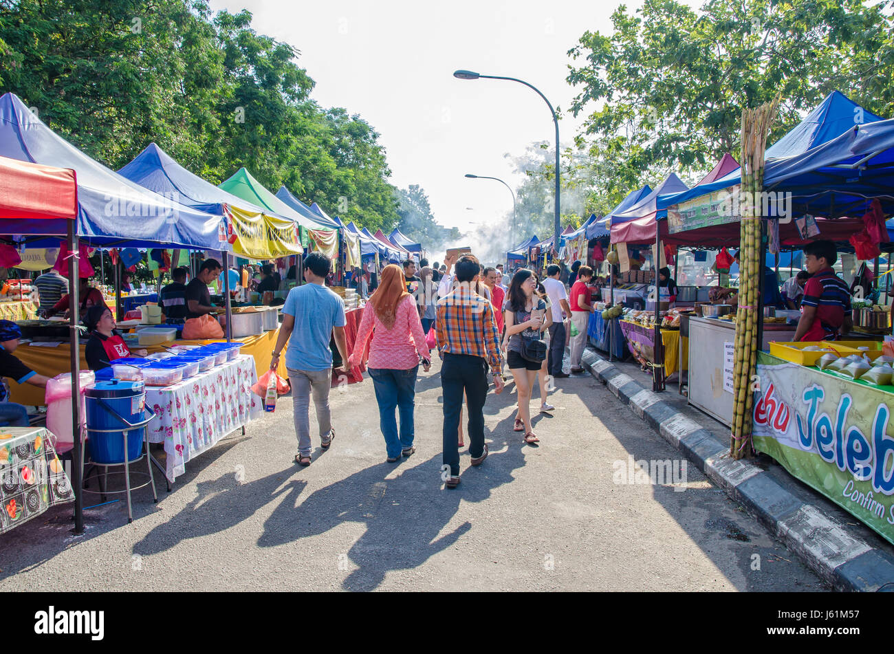 Kuala Lumpur,Malaysia - July 5, 2015: People seen walking and buying foods around the Ramadan Bazaar during the holy month of Ramadan. Stock Photo