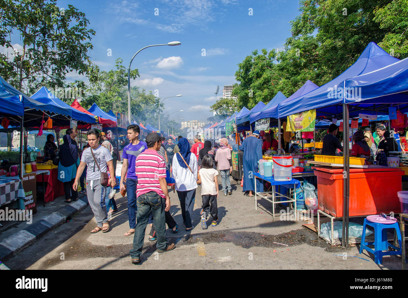 Kuala Lumpur,Malaysia - July 5, 2015: People seen walking and buying foods around the Ramadan Bazaar during the holy month of Ramadan. Stock Photo