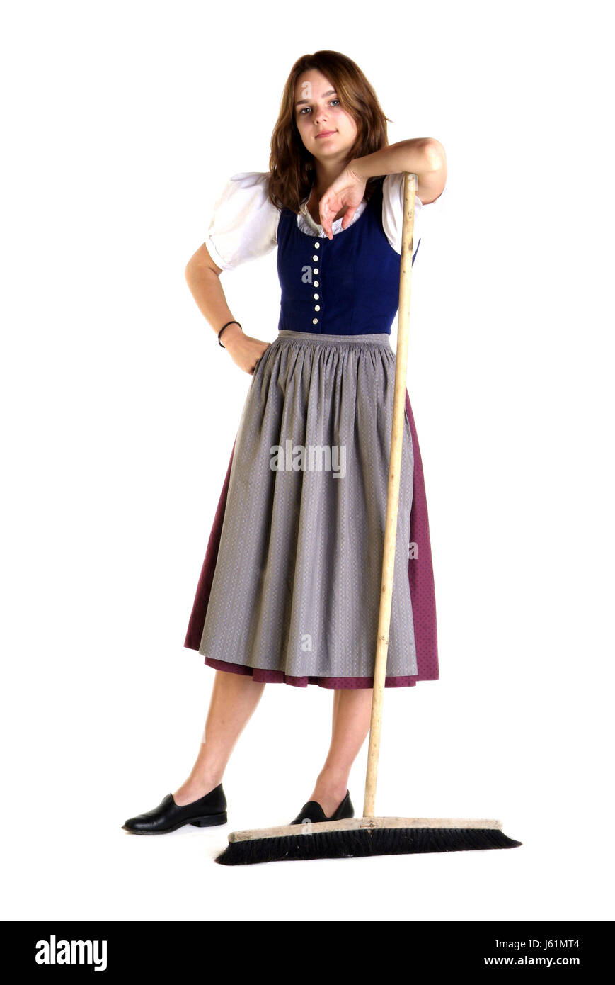 housewife household charme furbish broom charwoman dirndl woman fashion lady Stock Photo