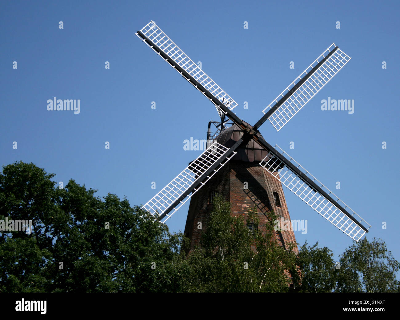 historical energy power electricity electric power windmill mill wind energy Stock Photo