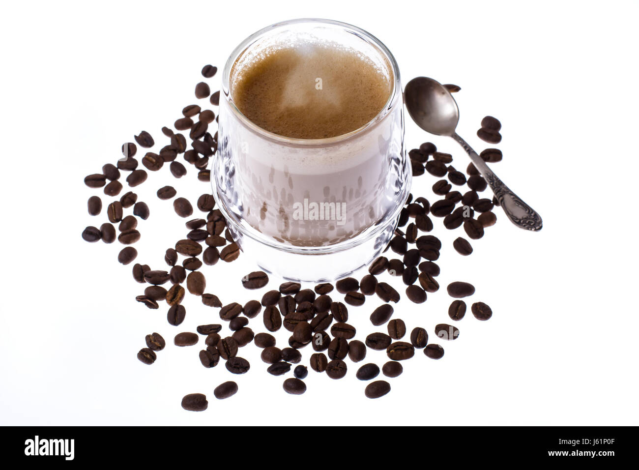 Coffee with milk in glass cup on white background. Studio Photo Stock Photo