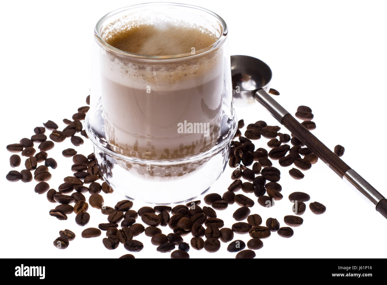 Coffee with milk in glass cup on white background. Studio Photo Stock Photo