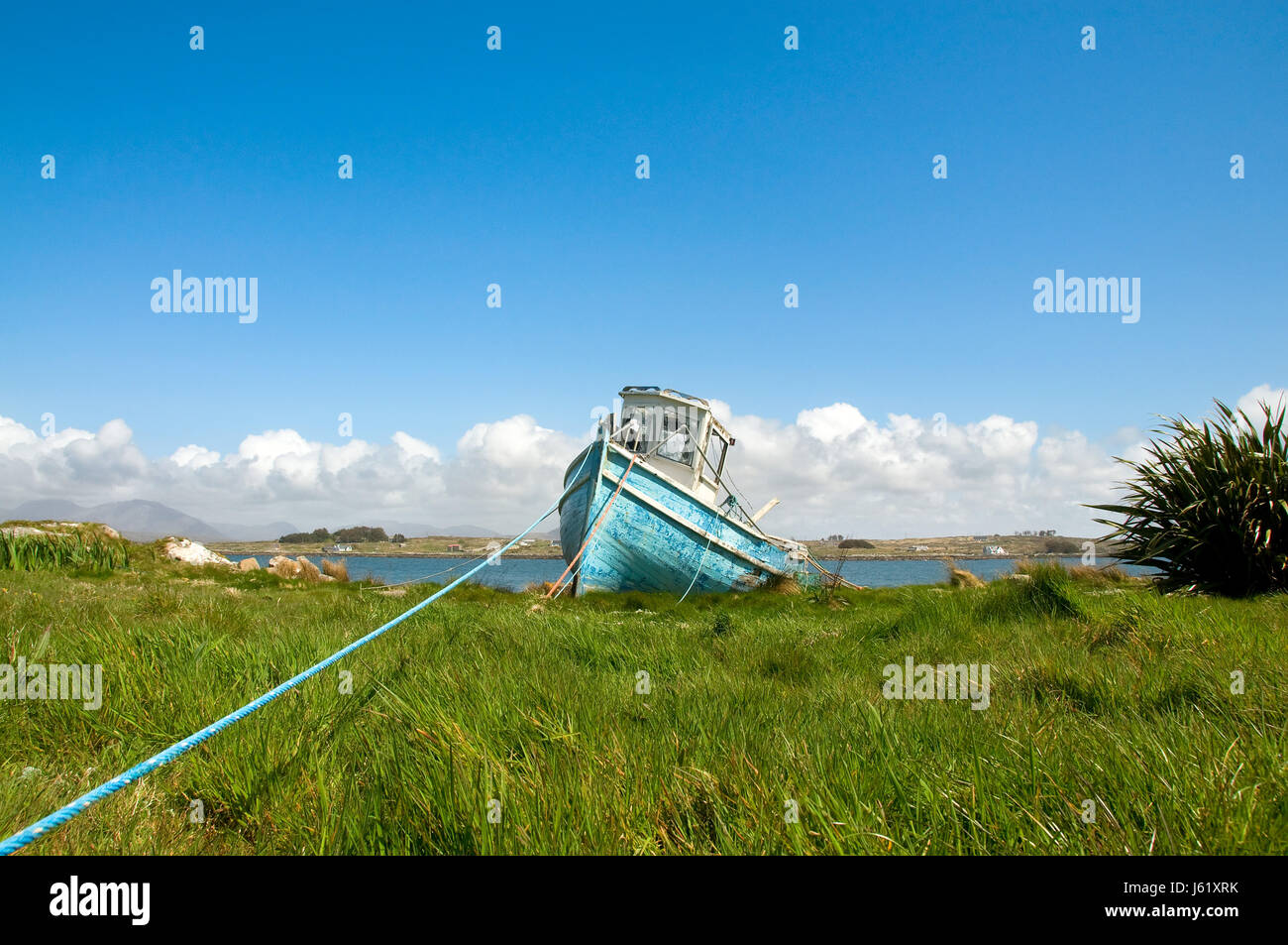 https://c8.alamy.com/comp/J61XRK/fishing-boat-on-dry-land-J61XRK.jpg
