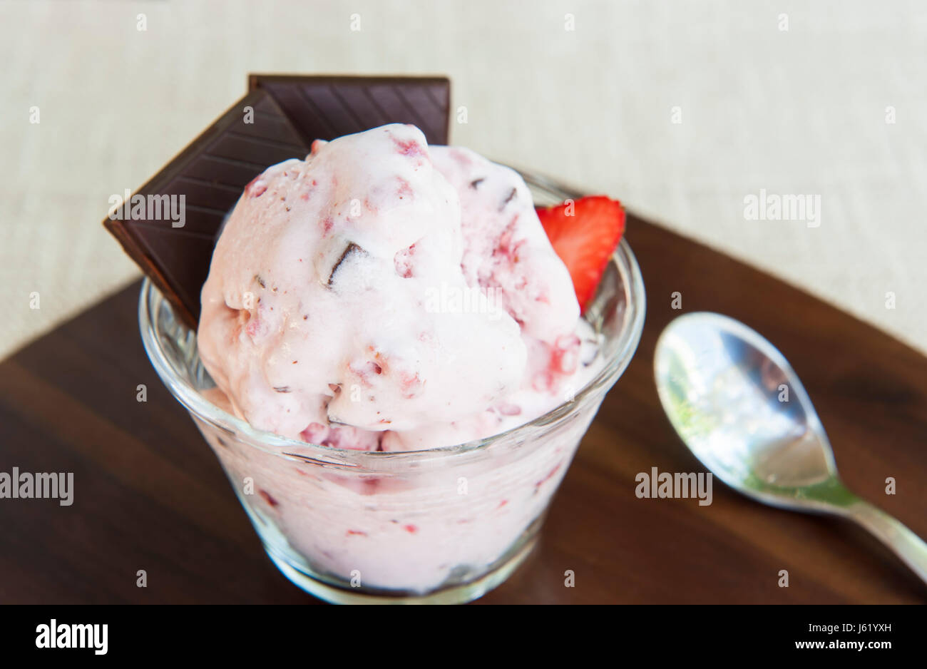 Strawberry coconut dairy-free ice cream with dark chocolate chunks Stock Photo