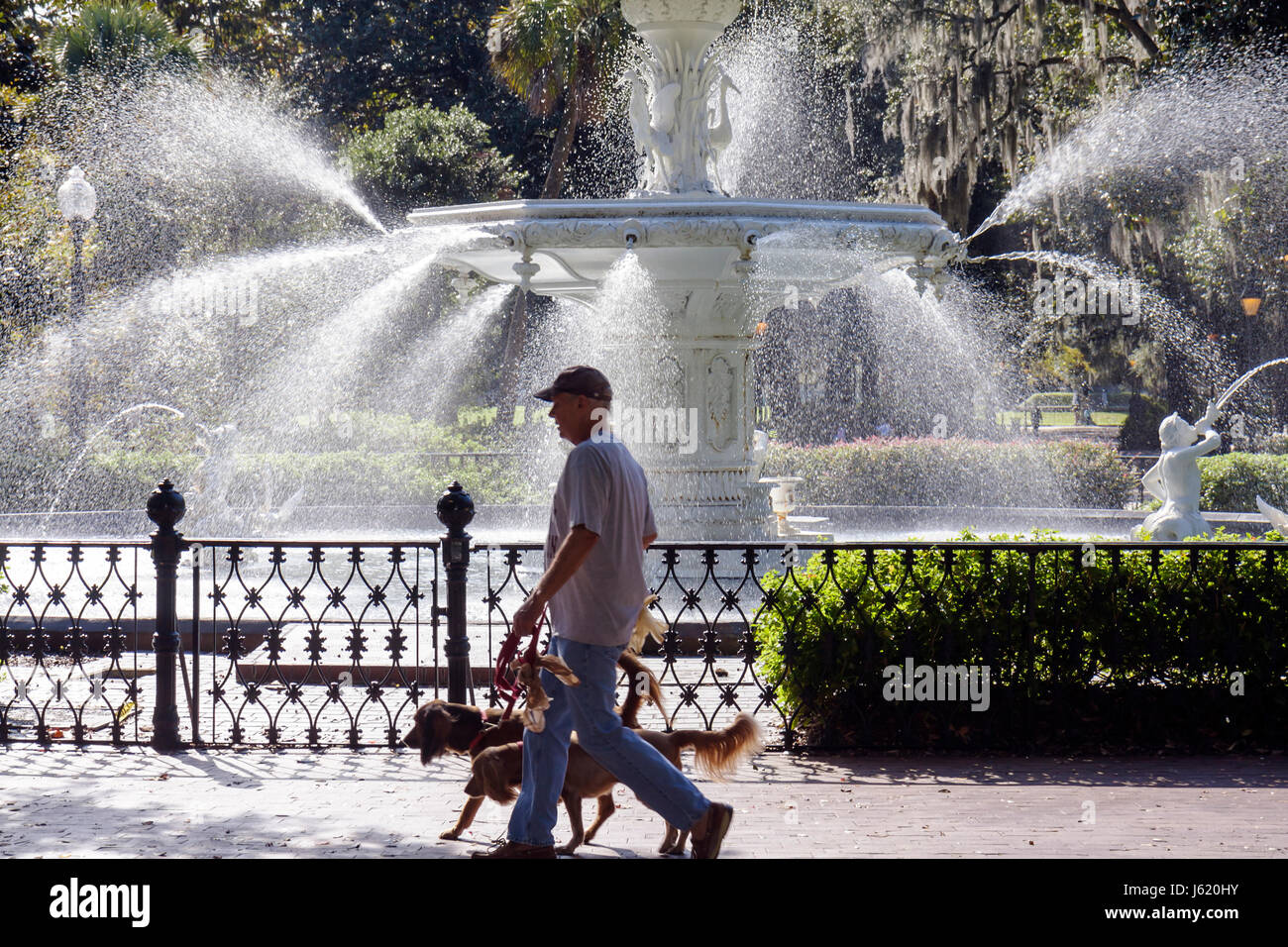 Georgia Savannah,Savannah Historic District,Forsyth Park Fountain,1858,cast iron fountain,water spouts,ornamental wrought iron fence,man men male adul Stock Photo