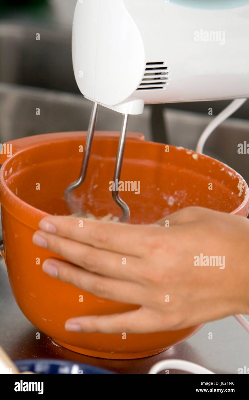 engine drive motor kitchen cuisine bake stir orange dough bowl woman