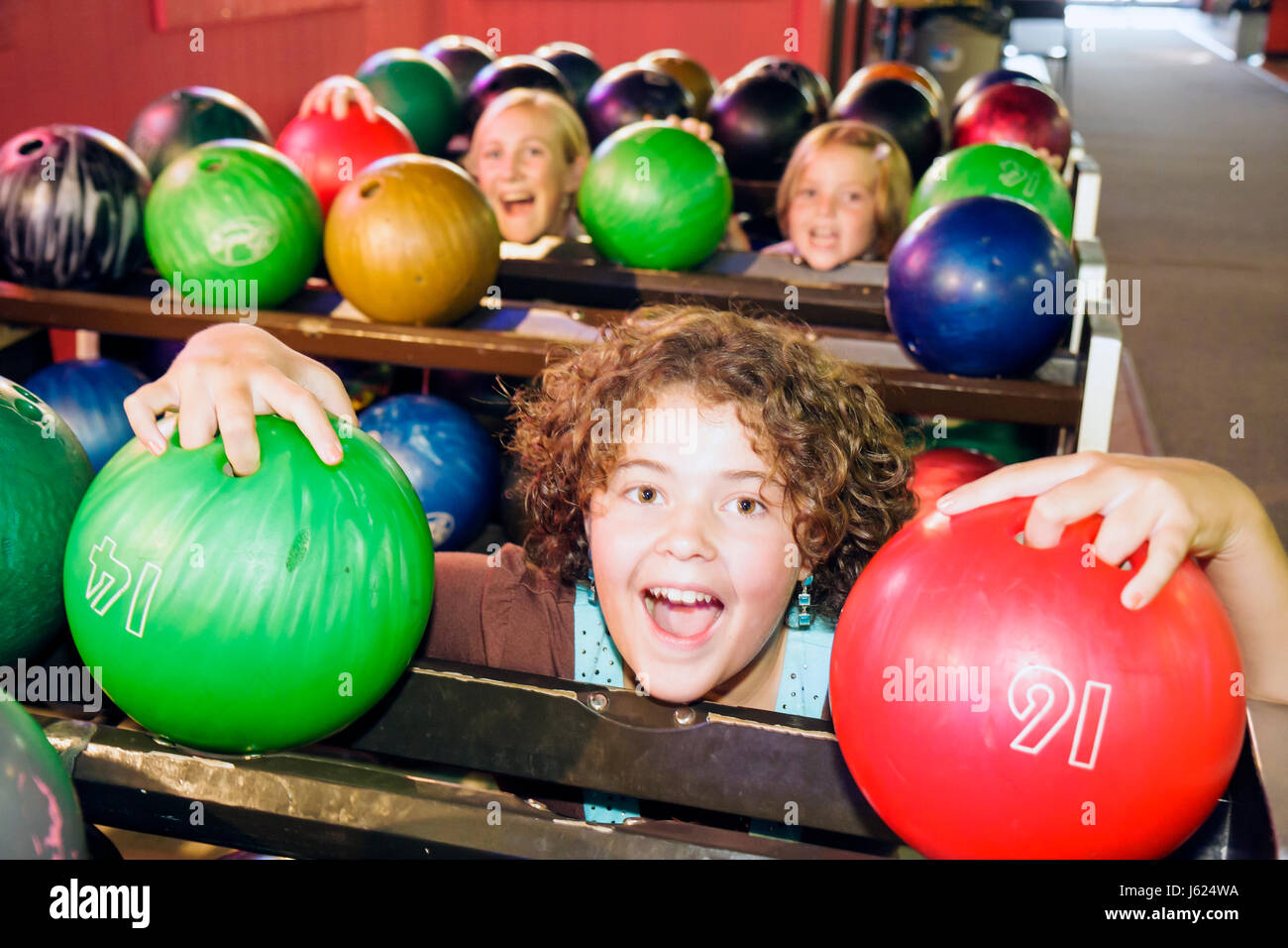 Valparaiso Indiana,Inman's Fun & Party Center,centre,bowling,ten pin bowling balls,green,red,girls,teen,teens,play,amusement,fun,IN080720065 Stock Photo