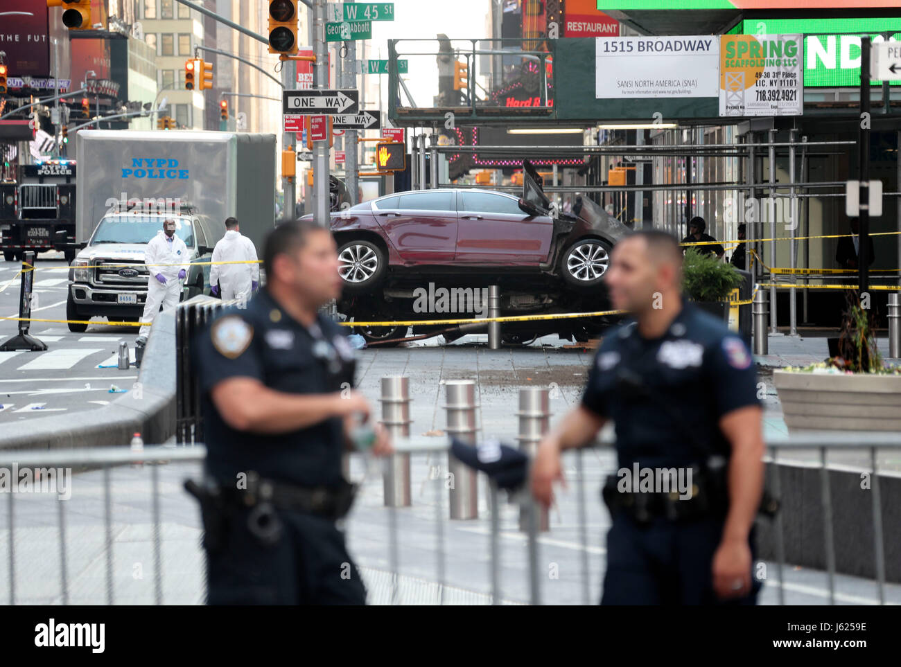 New York, USA. 18th May, 2017. Investigators work on the scene of a car crash incident at Times Square in New York City, the United States, on May 18, 2017. The man who drove a car into a crowd in Times Square on Thursday was in custody, in which one was killed and 22 others injured, New York's mayor said. Credit: Wang Ying/Xinhua/Alamy Live News Stock Photo