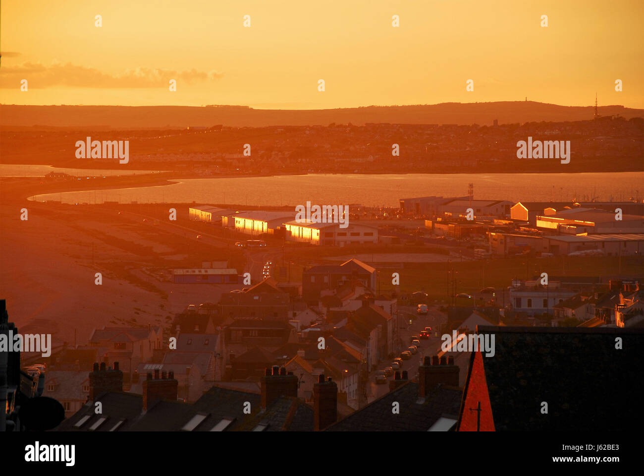 sunset over Chesil Beach and Portland Stock Photo Alamy