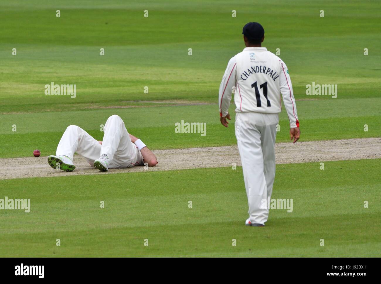 Manchester  UK  19th May 2017 James Anderson  suffes a groin injury in his sixth over on the first day of the County Championship match for Lancashire against Yorkshire at Emirates Old Trafford. Stock Photo