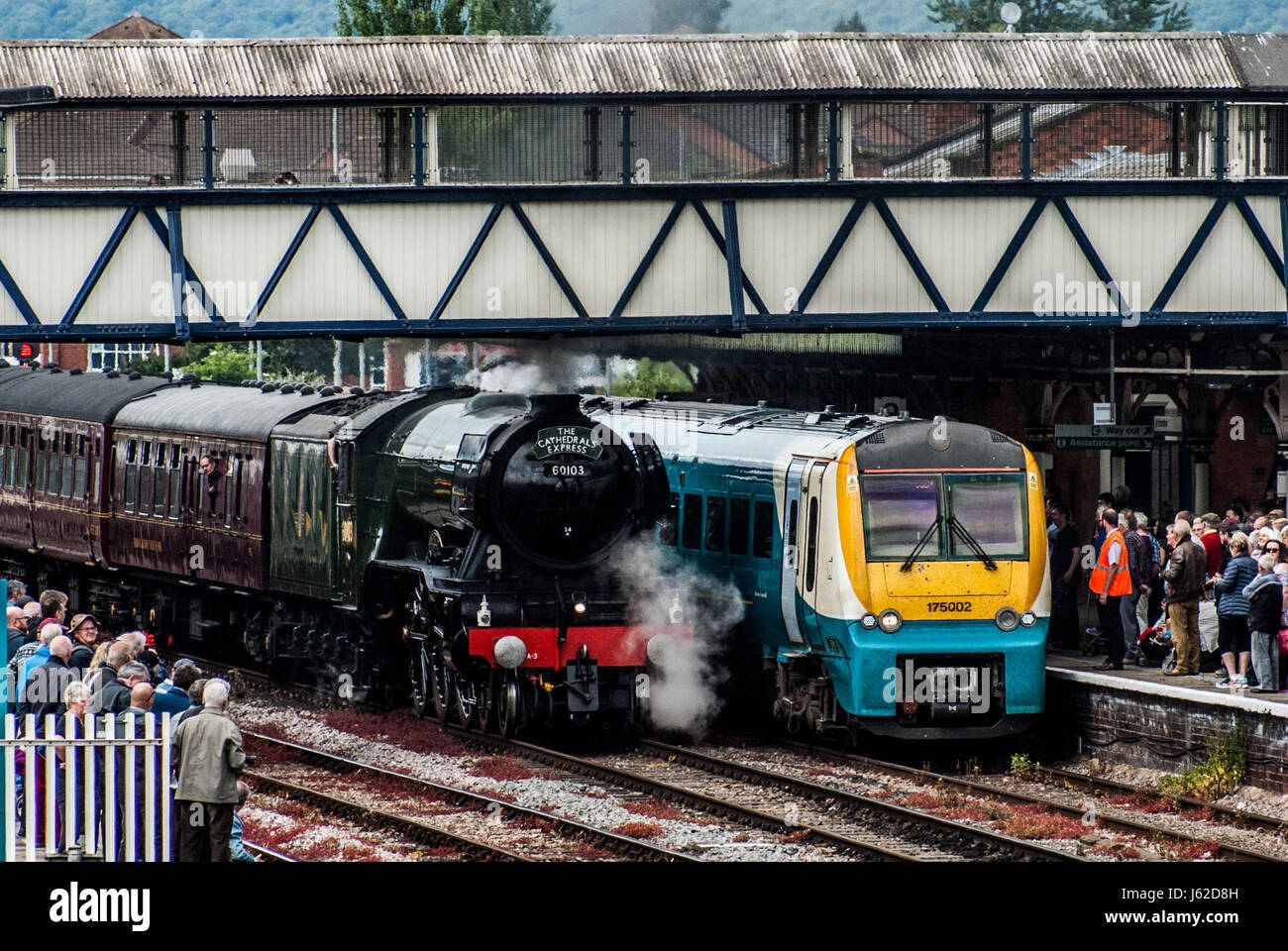 Hereford, Herefordshire. 19th May 2017. The Flying Scotsman is seen next to a modern diesel locamotive as crowds gather to see Pacific steam locomotive LNER Class A3 4472 commonly known as the Flying Scotsman at Hereford railway station as it travels from Shrewsbury to Cardiff and then Newport to Bristol Parkway via Gloucester. The 94 year old Flying Scotsman was originally built in Doncaster for the London and North Eastern Railway (LNER), emerging from the works on 24 February 1923. Credit: Jim Wood/Alamy Live News Stock Photo