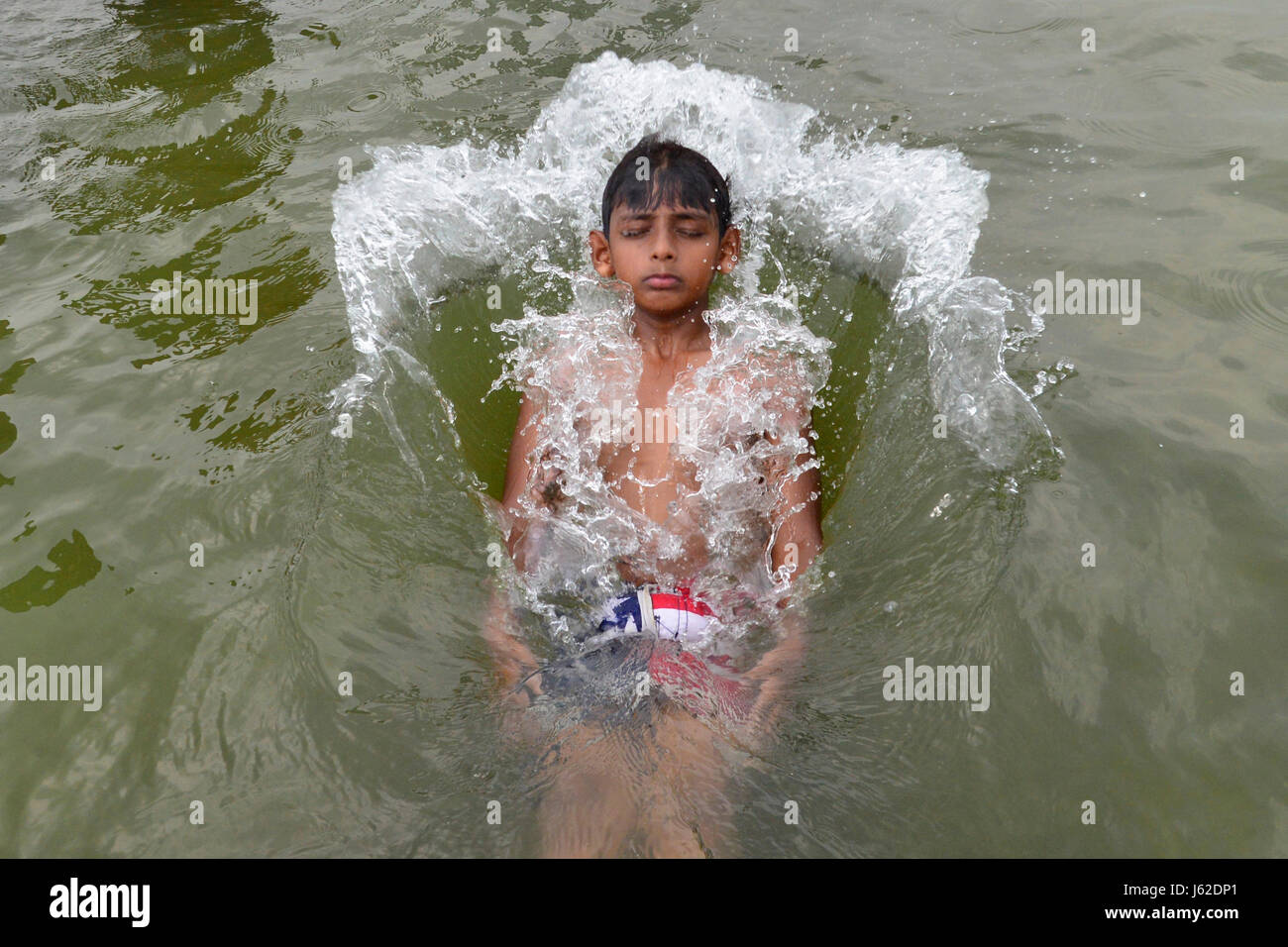 Indian kids bathing playing water hi-res stock photography and images ...