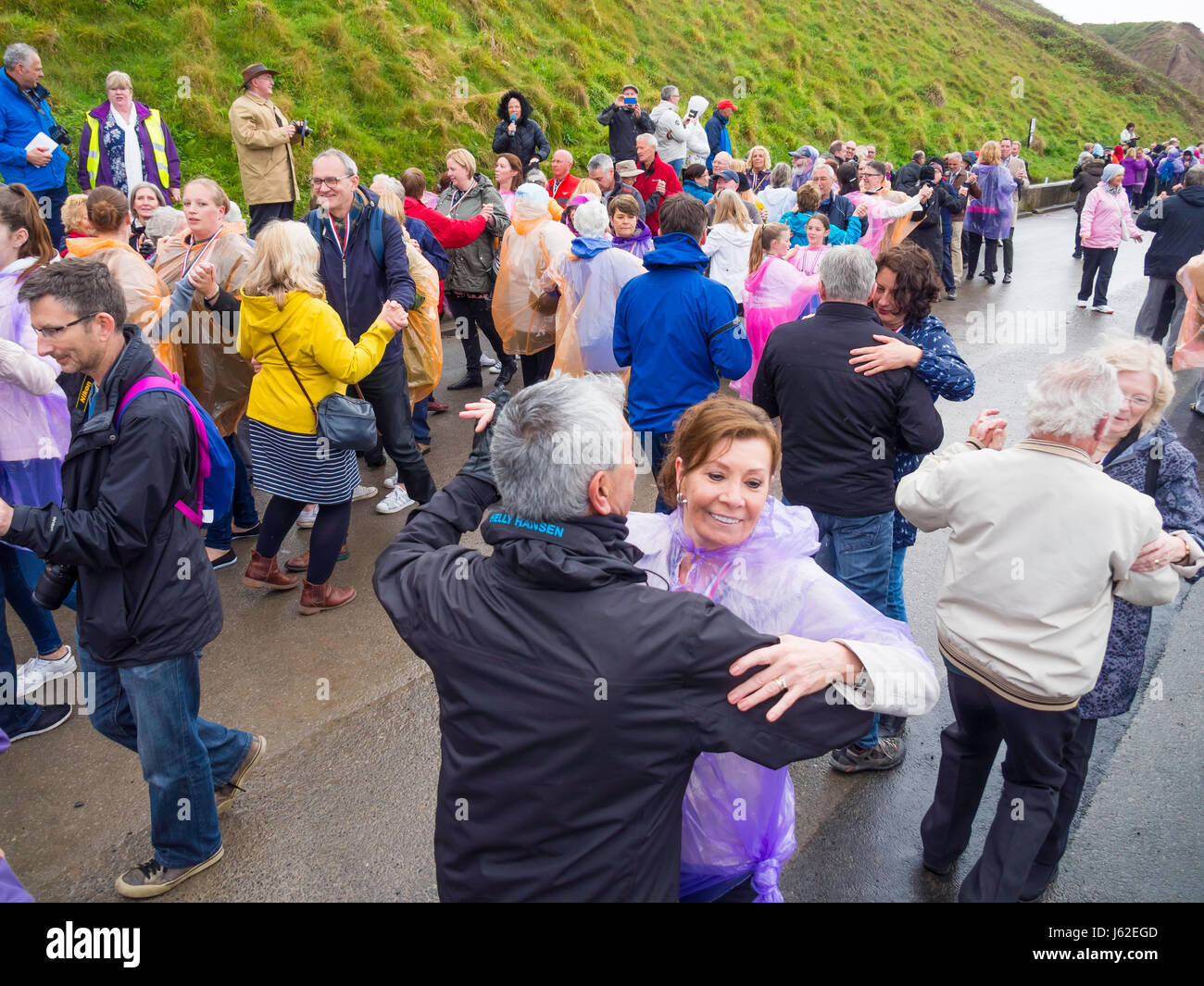 Saltburn by the Sea North Yorkshire 19th May 2017.  This afternoon on the seaside promenade at Saltburn an attempt was made to break the world record for the numbers of couples dancing the Waltz.  In the Guinness Book of Records, the current record, set in 2007, is held by Bosnia with 1510 couples,  The event was sponsored by Age UK with the slogan “Loving Later Life”.  To break the record at least 2010 couples have to Waltz for five minutes. The weather was rainy, but for the period of the record attempt, the rain stopped. Credit: Peter Jordan NE/Alamy Live News Stock Photo