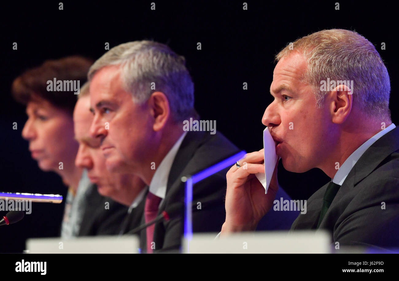 Carsten Kengeter (r), chairman of the Deutsche Boerse AG (lit. 'German stockmarket'), sits next to board members Hauke Stars (l-r), Andreas Preuss and Gregor Pottmeyer during the general assembly of the company at the 'Jahrhunderthalle' in Frankfurt/Main, Germany, 17 May 2017. Photo: Arne Dedert/dpa Stock Photo