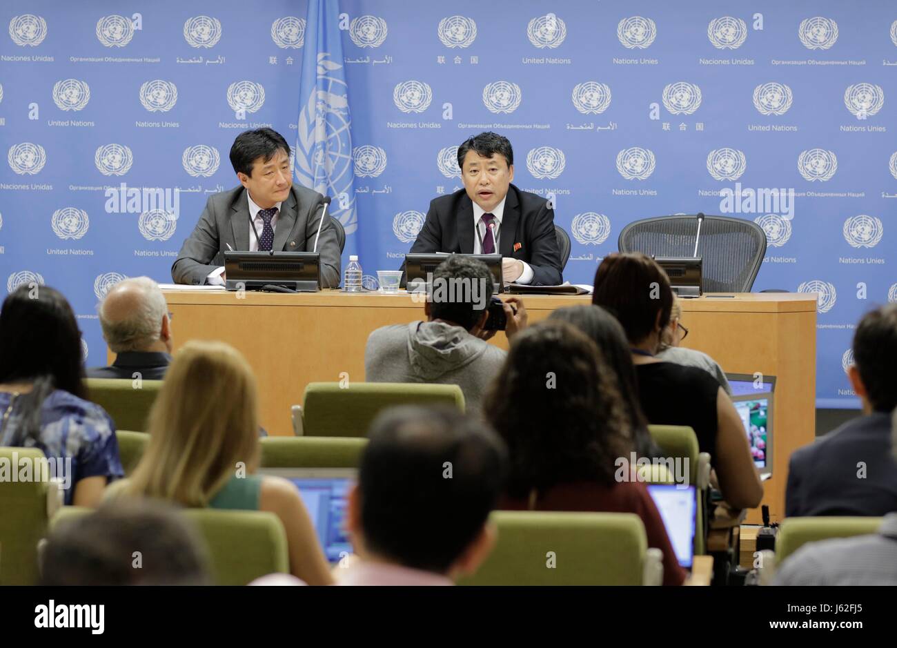United Nations, New York, USA, May 19 2017 - Kim In Ryong (right), Deputy Permanent Representative of the Democratic Peoples Republic of Korea (DPRK) to the UN, briefs Journalists on the US Planning of Introducing more Sanctions at the Security Council Against his Country today at the UN Headquarters in New York. Photo: Luiz Rampelotto/EuropaNewswire | usage worldwide Stock Photo