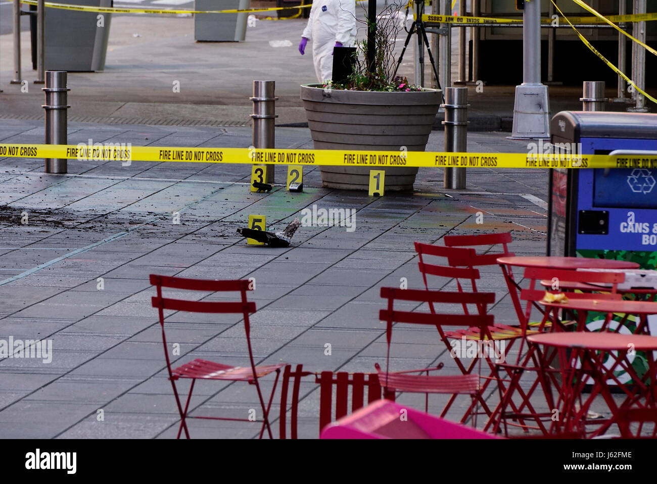 New York, New York, USA. 18th May, 2017. Crime scene markers near the damaged vehicle as emergency workers investigate the scene of a car crash in Times Square that took the life of an 18 year-old Michigan girl and injured 22 others Credit: Kevin C. Downs/ZUMA Wire/ZUMAPRESS.com/Alamy Live News Stock Photo