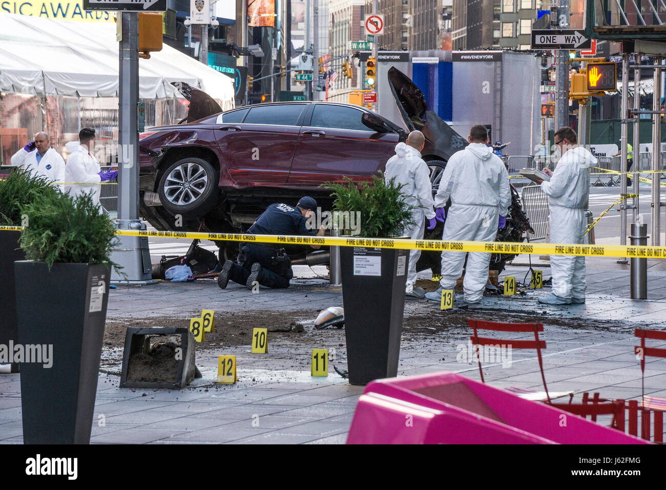 New York, New York, USA. 18th May, 2017. Crime scene markers near the damaged vehicle as Police officers and emergency workers investigate the scene of a car crash in Times Square that took the life of an 18 year-old Michigan girl and injured 22 others. Credit: Kevin C. Downs/ZUMA Wire/ZUMAPRESS.com/Alamy Live News Stock Photo