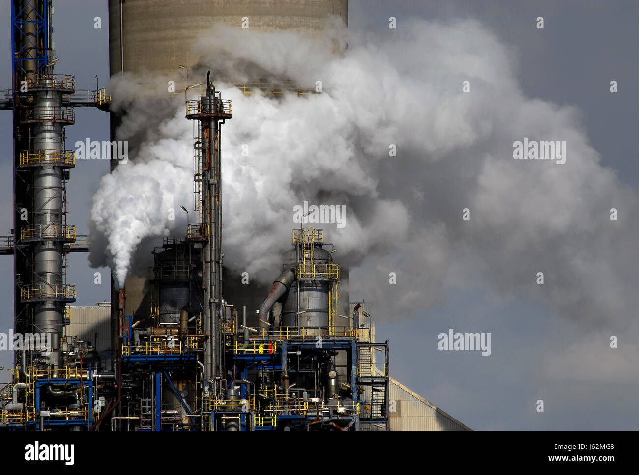 smoke smoking smokes fume industry environmental pollution refinery industrial Stock Photo