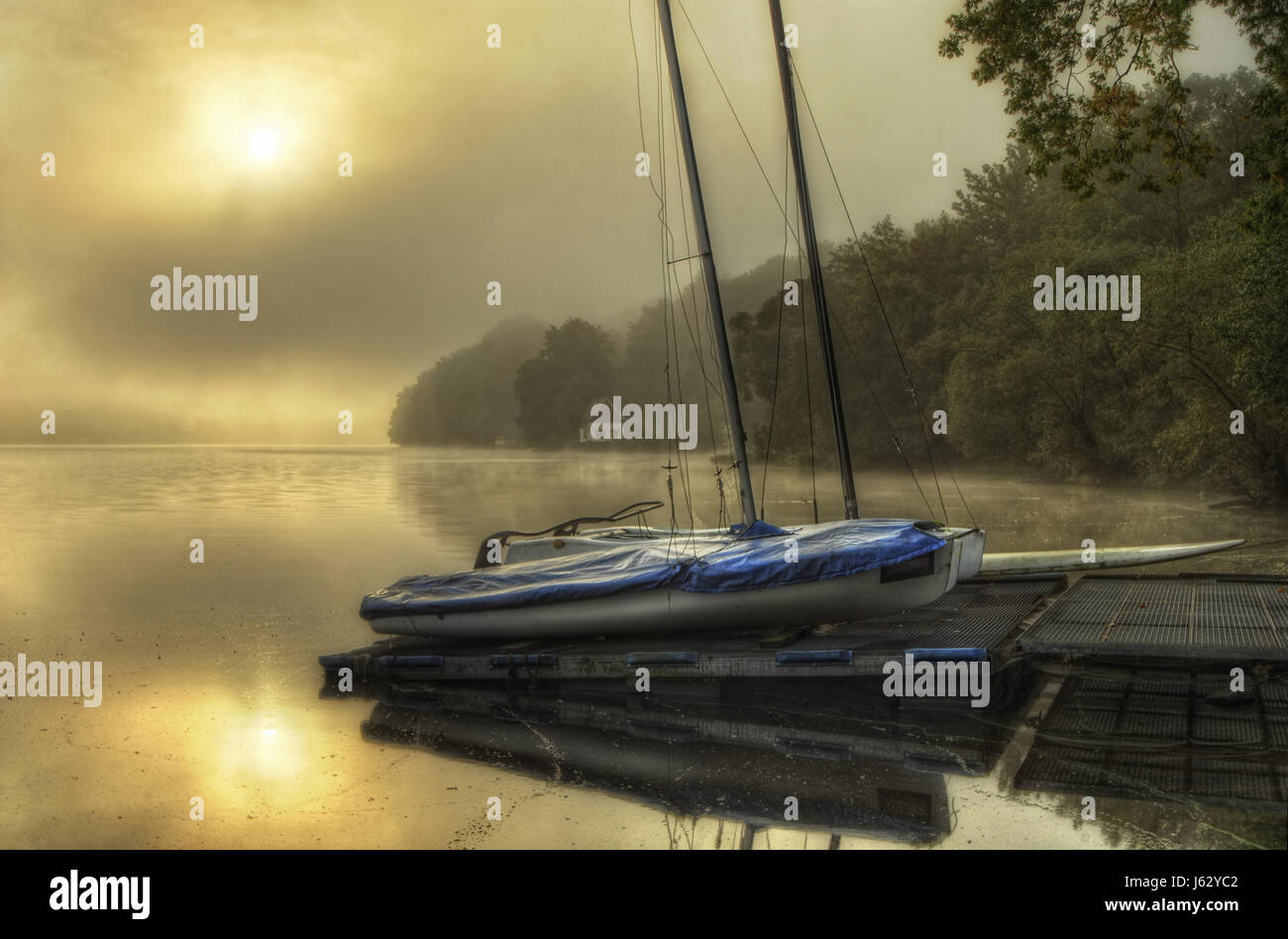 fog mood bridge windlessness fresh water lake inland water water rowing boat Stock Photo