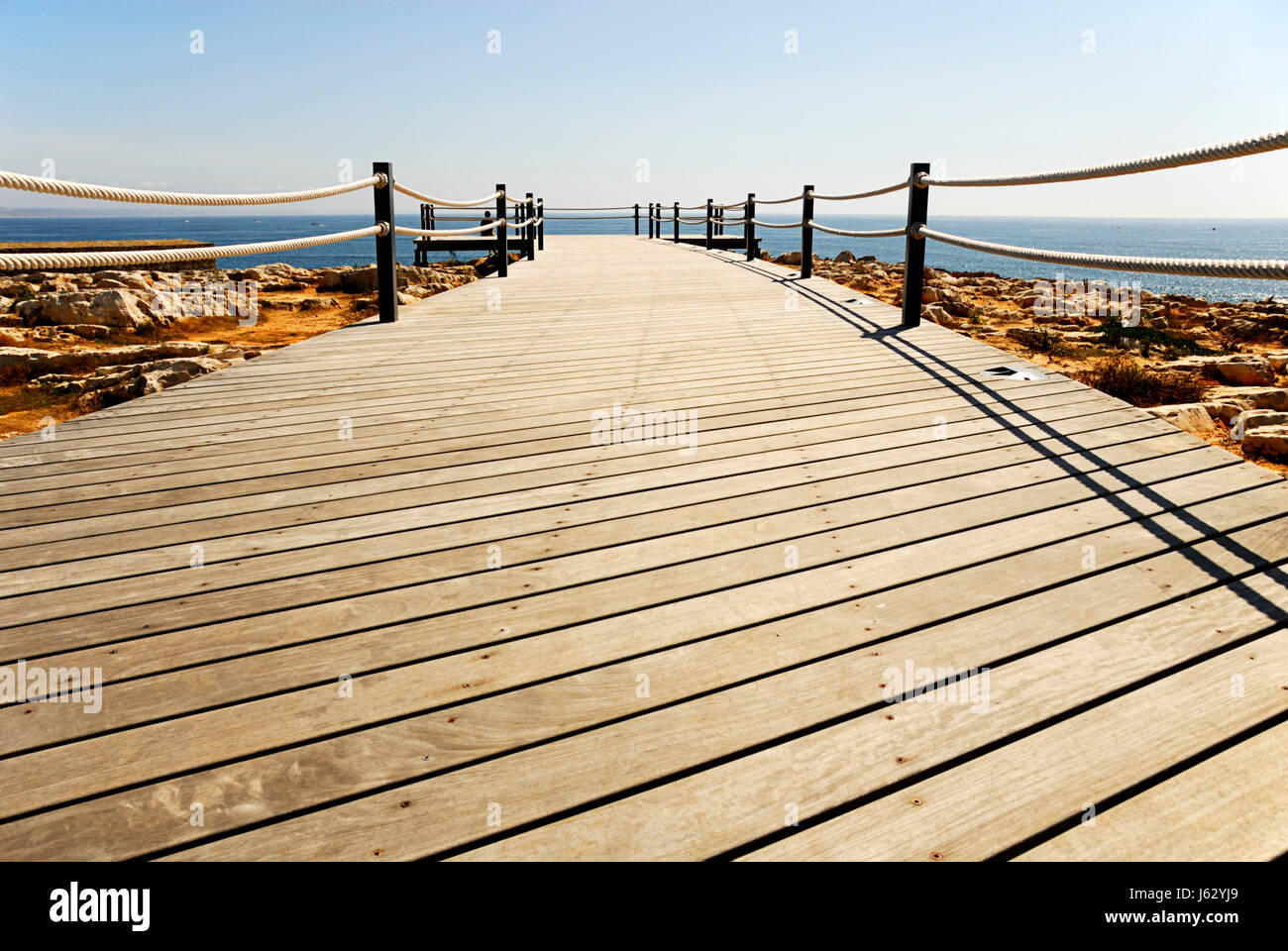 wood lines bridge shape structure salt water sea ocean water scenery ...