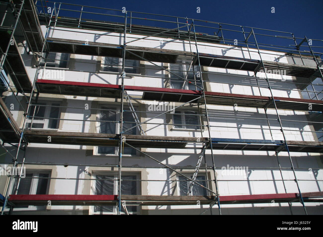 new building scaffold scaffolding redevelopment house building build home Stock Photo