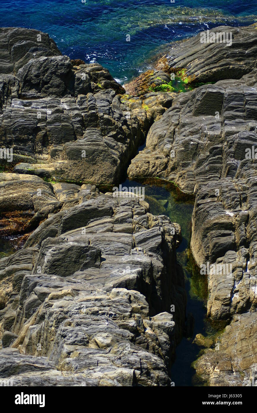 flow rock ceramic tiles coast salt water sea ocean water crack fissure