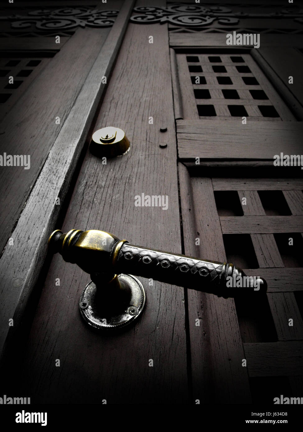 door handle gold church wood doorknob impressing heavy hard handle dark klinke Stock Photo