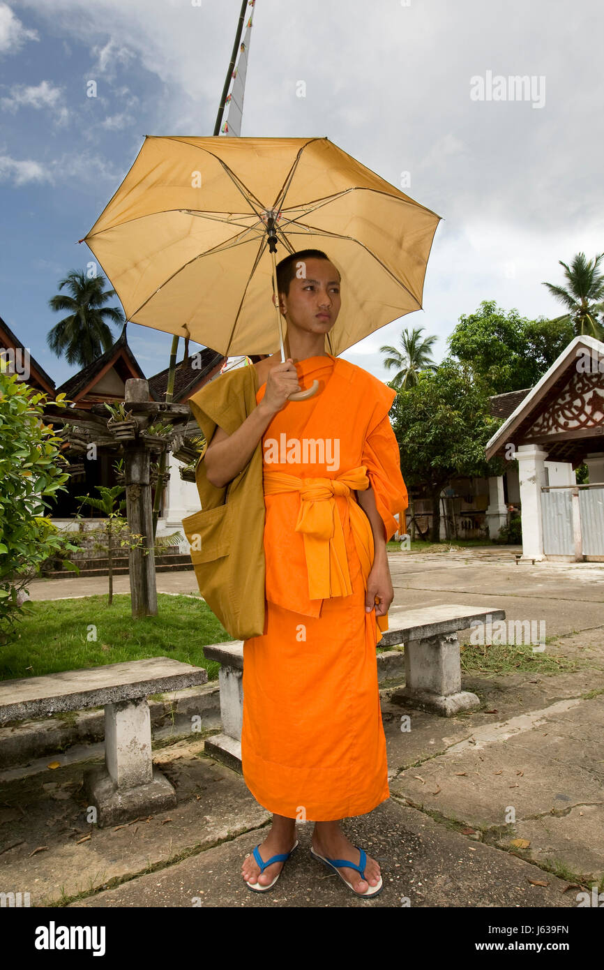 religion asia monk buddhism religion belief temple asia person umbrella