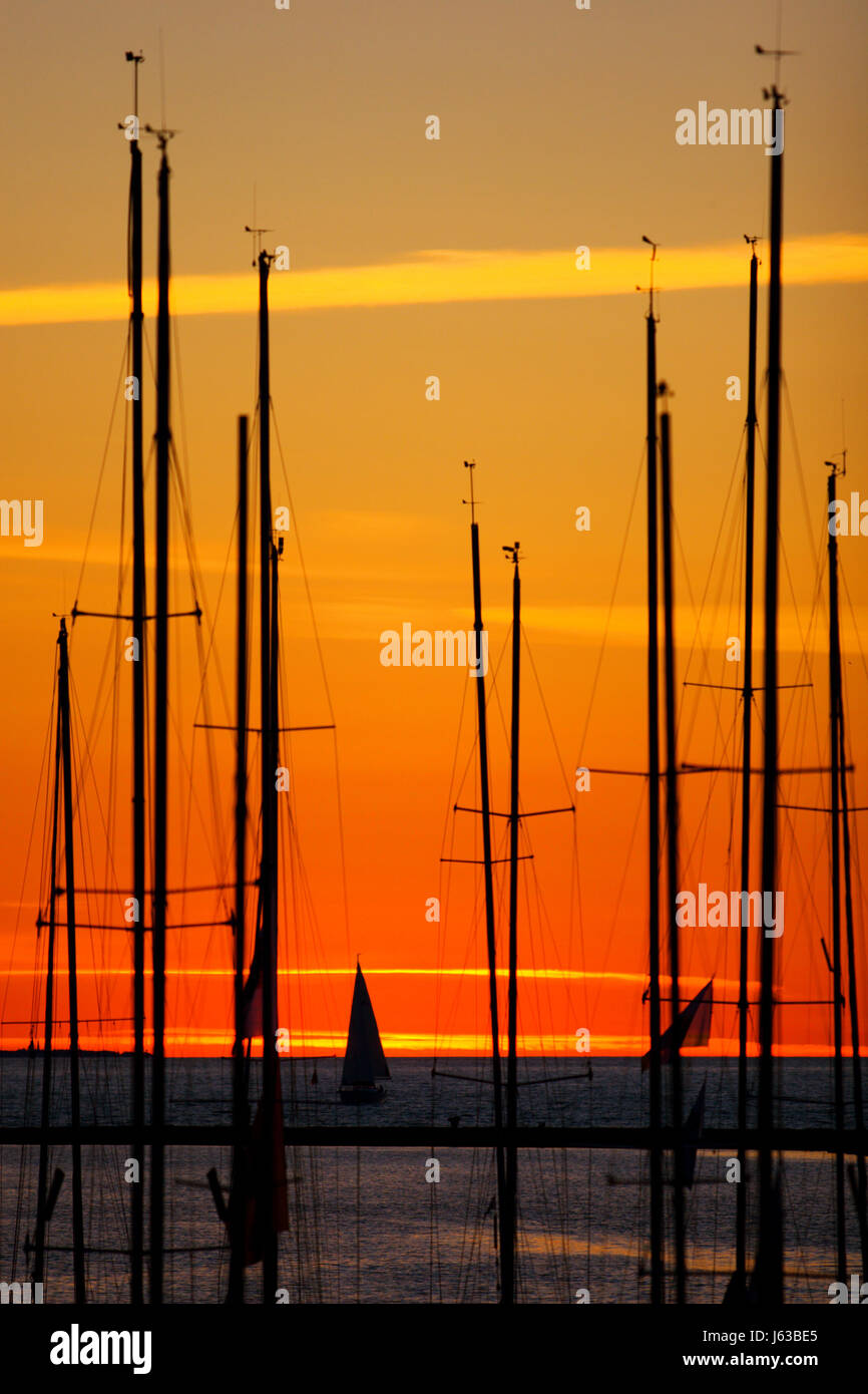 beautiful beauteously nice sunset sail yacht mast boat salt water sea ocean Stock Photo