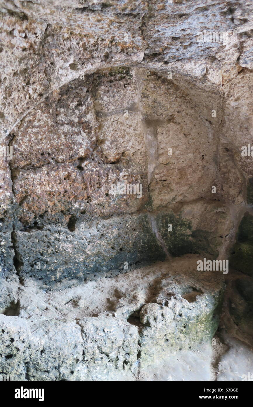 A niche cut into the rock above the ancient Greek theatre at Temenites ...