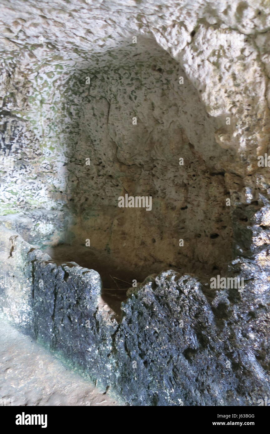 A niche cut into the rock above the ancient Greek theatre at Temenites ...