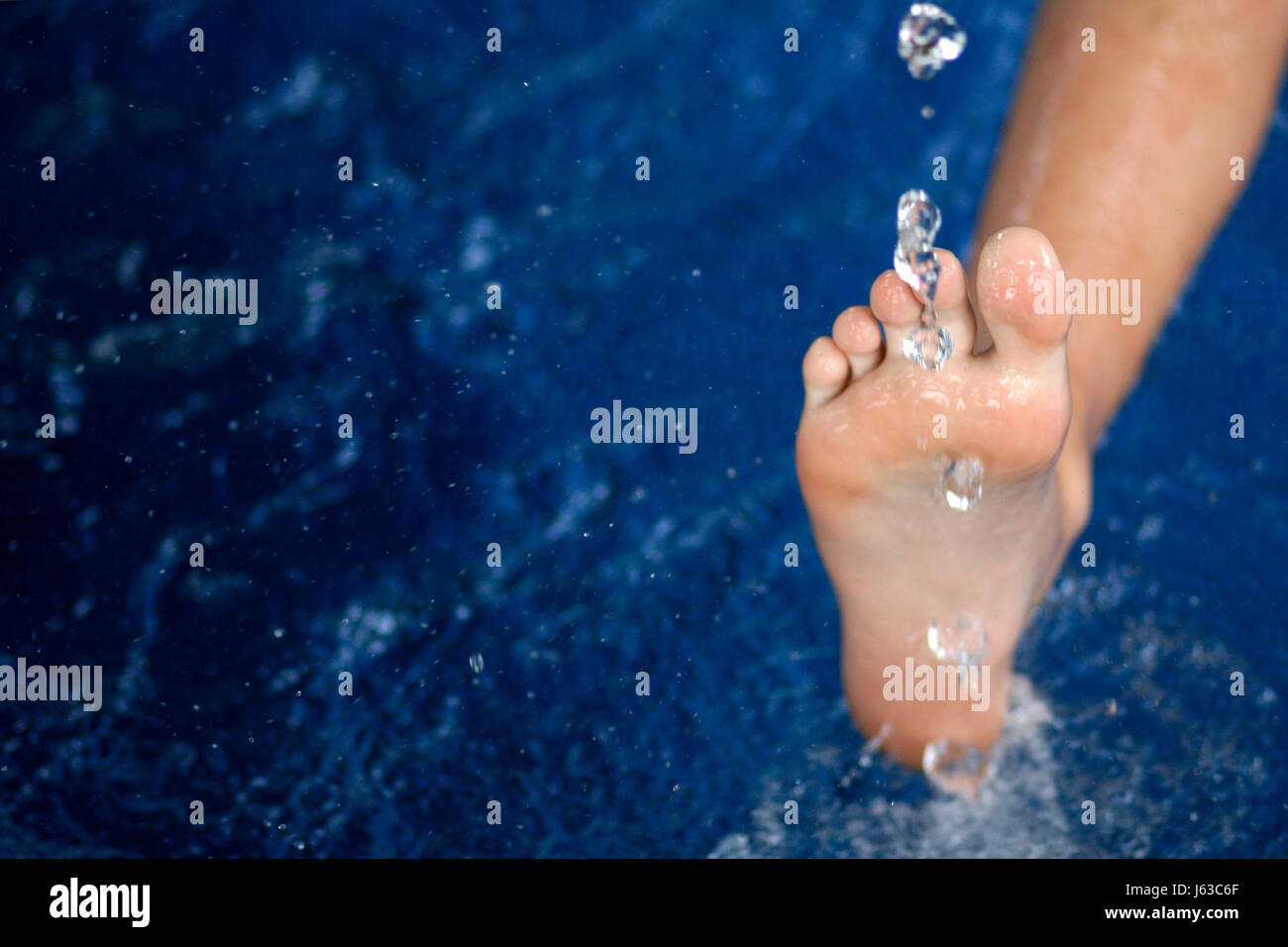 toes wellness wet leg immersed clean water blue cold skin foot wellness wet Stock Photo