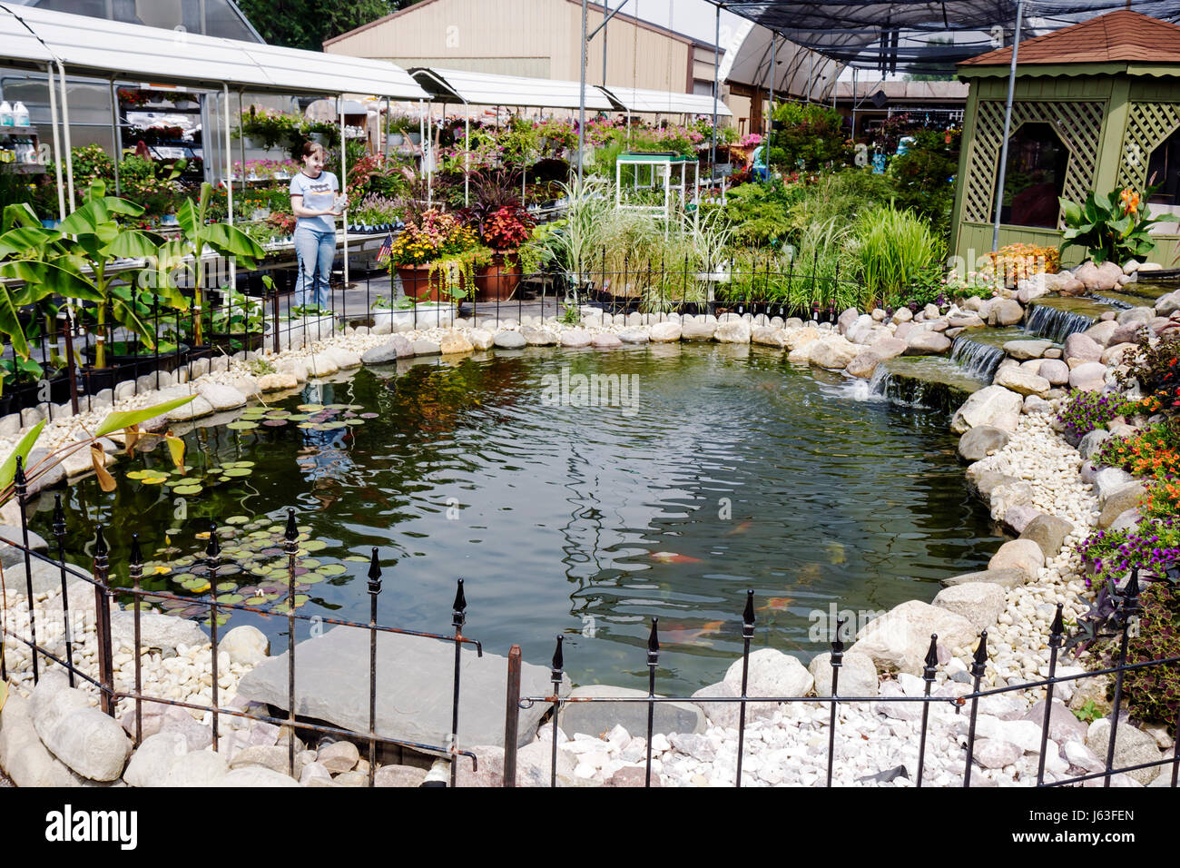 Indiana Chesterton,Chesterton Feed & Garden Center,centre,plant nursery,flower,flower,indoor plants,horticulture,pots,landscaping,pond,waterfall,woman Stock Photo