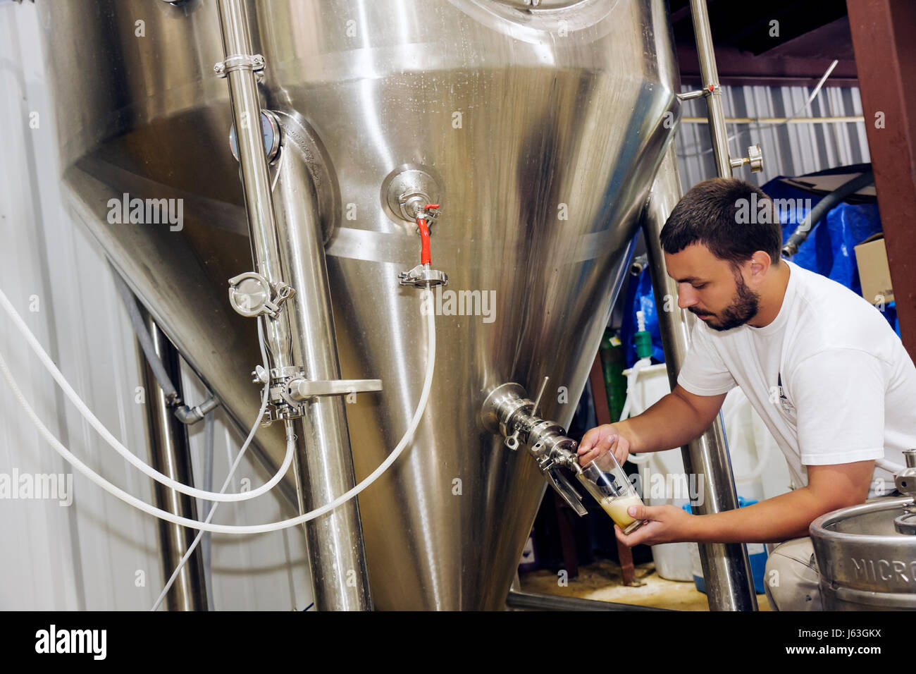 Michigan Baroda,The Round Barn Winery Distillery & Brewery,beer,stainless steel vat,microbrew,hand crafted,testing,man men male,conical fermented,pour Stock Photo