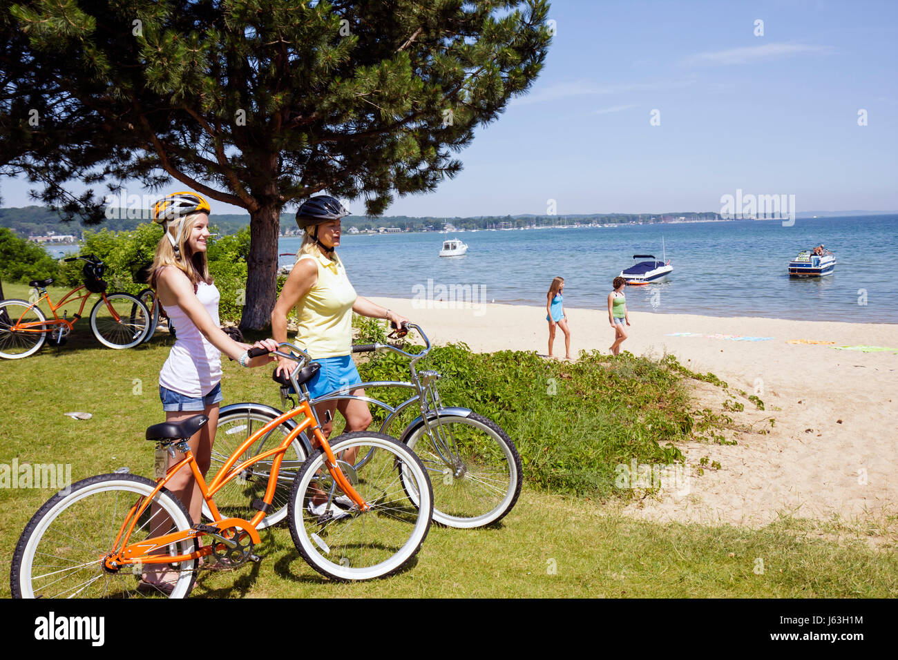 Traverse City Michigan,West Arm Grand Traverse Bay water,Clinch Park,adult adults woman women female lady,girl girls,youngster youngsters youth youths Stock Photo