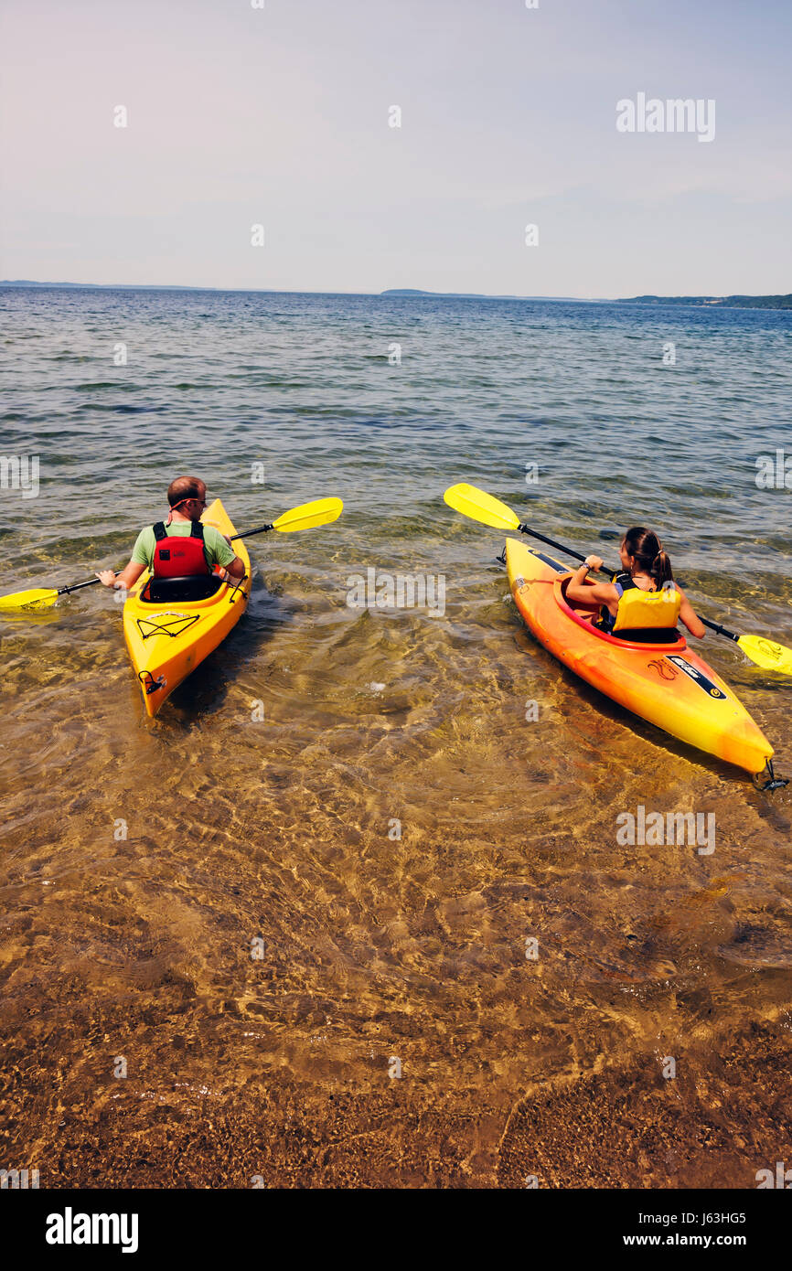 Michigan Traverse City,West Arm Grand Traverse Bay,Clinch Park,kayak,man men male,woman female women,water,sport,activity,recreation,oars,paddle,yello Stock Photo