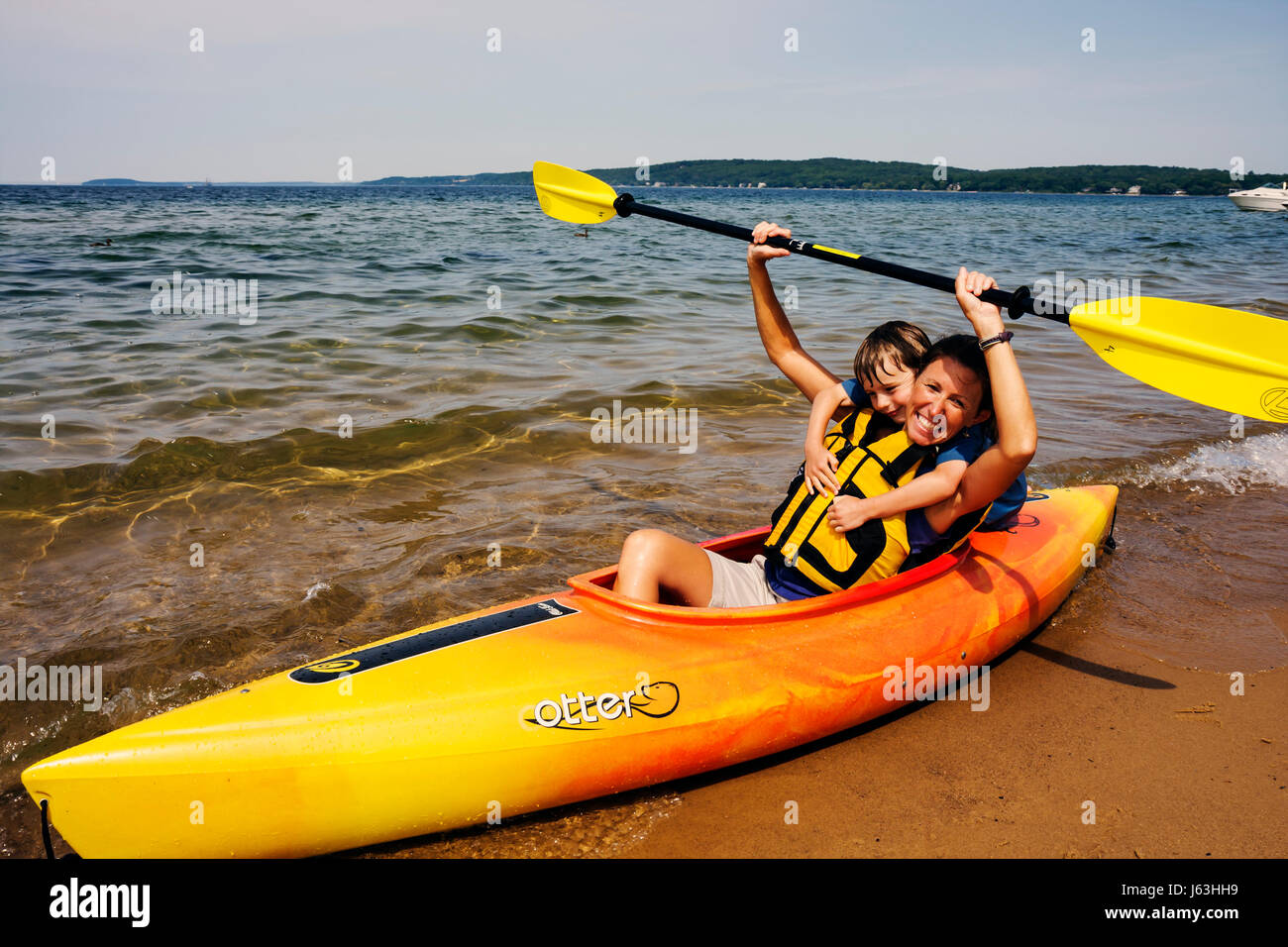 Traverse City Michigan,West Arm Grand Traverse Bay water,Clinch Park,kayak,adult adults woman women female lady,water,sport,activity,recreation,oars,p Stock Photo