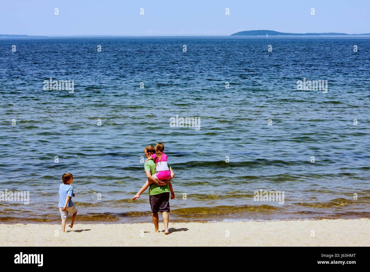 Michigan Traverse City,West Arm Grand Traverse Bay,Clinch Park,man men male,boy boys,kid kids child children youngster,girl girls female,parent,child, Stock Photo