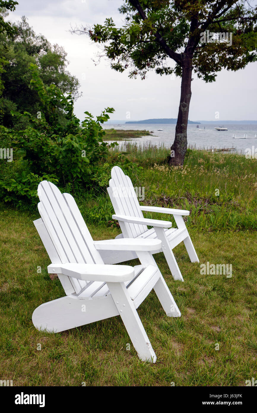 Traverse City Michigan,Old Mission Peninsula,West Arm Grand Traverse Bay water,Bowers Harbor,harbour,Adirondack chairs,tree trees,peaceful,relax,sceni Stock Photo