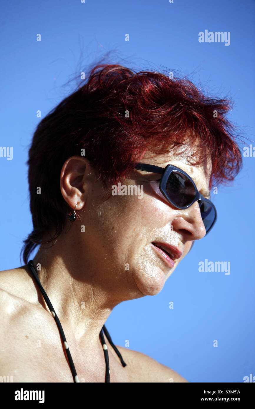 red-haired woman in her 50s Stock Photo